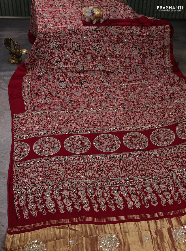 Modal silk saree maroon with allover ajrakh prints and mirror & sequin embroidery pallu