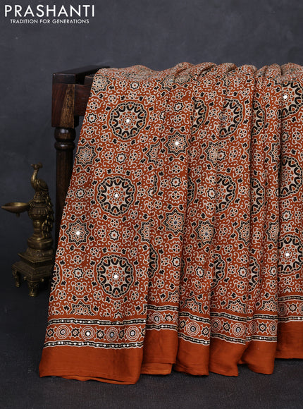 Modal silk saree dark mustard with allover ajrakh prints and mirror & sequin embroidery pallu