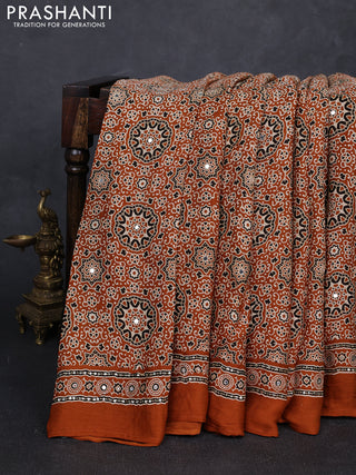 Modal silk saree dark mustard with allover ajrakh prints and mirror & sequin embroidery pallu