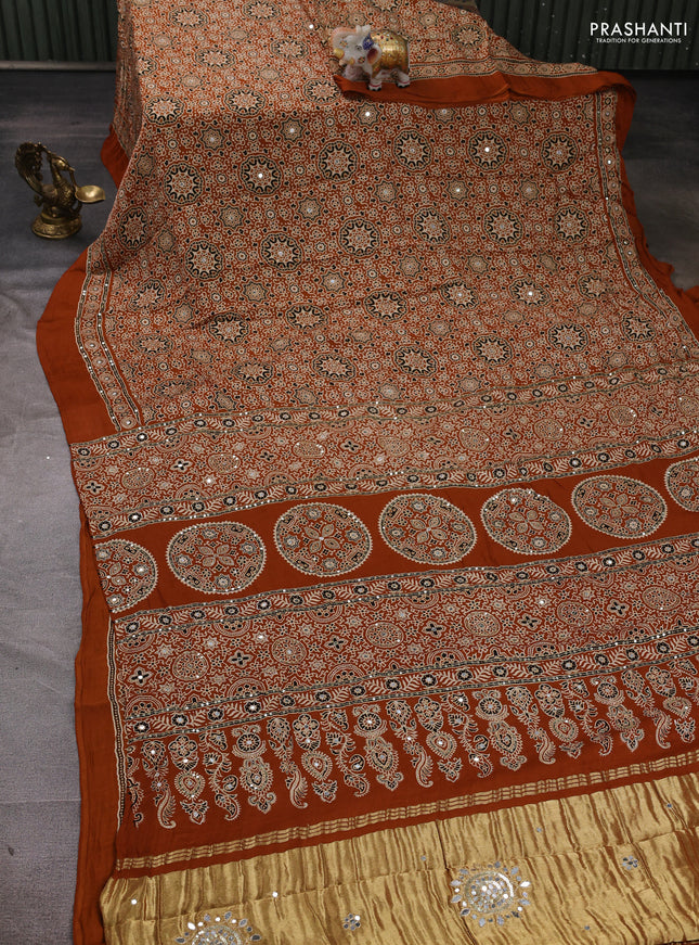 Modal silk saree dark mustard with allover ajrakh prints and mirror & sequin embroidery pallu