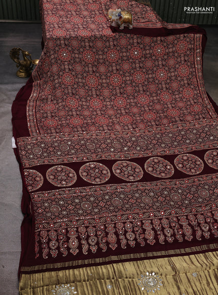 Modal silk saree deep maroon with allover ajrakh prints and mirror & sequin embroidery pallu