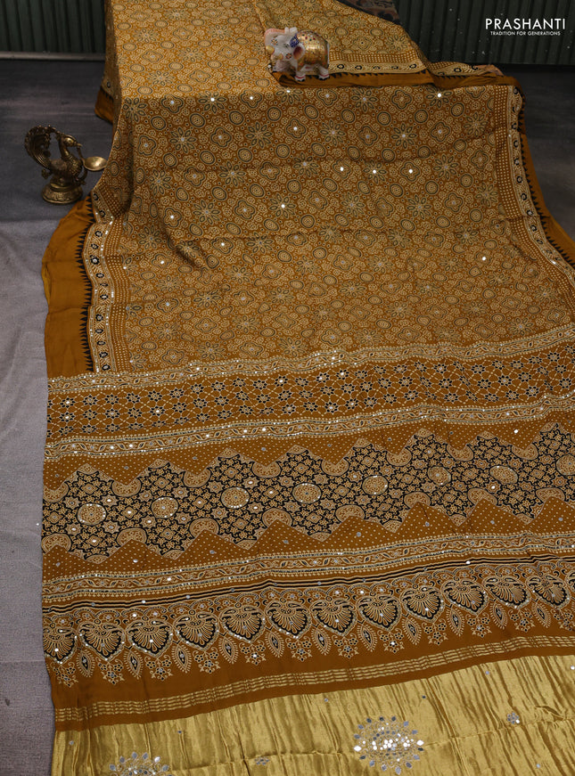 Modal silk saree dark mustard with allover ajrakh prints and mirror & sequin embroidery pallu