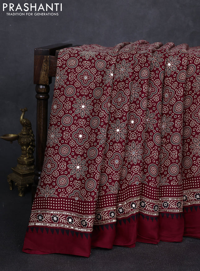 Modal silk saree maroon with allover ajrakh prints and mirror & sequin embroidery pallu