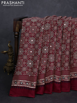 Modal silk saree maroon with allover ajrakh prints and mirror & sequin embroidery pallu
