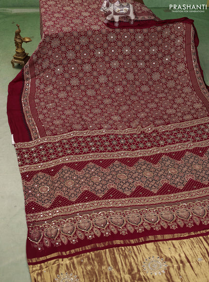 Modal silk saree maroon with allover ajrakh prints and mirror & sequin embroidery pallu