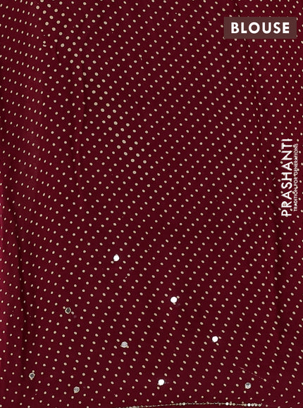 Modal silk saree maroon with allover ajrakh prints and mirror & sequin embroidery pallu