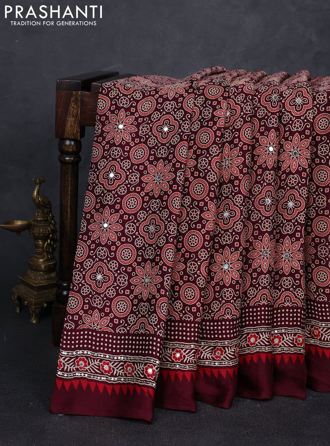 Modal silk saree deep maroon with allover ajrakh prints and mirror & sequin embroidery pallu