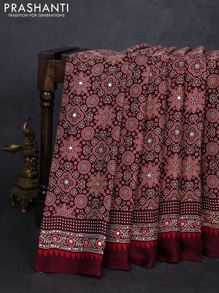 Modal silk saree deep maroon with allover ajrakh prints and mirror & sequin embroidery pallu