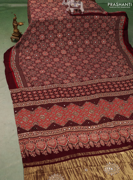 Modal silk saree deep maroon with allover ajrakh prints and mirror & sequin embroidery pallu