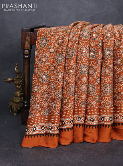 Modal silk saree dark mustard with allover ajrakh prints and mirror & sequin embroidery pallu