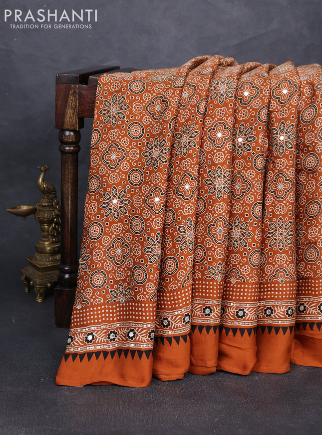 Modal silk saree dark mustard with allover ajrakh prints and mirror & sequin embroidery pallu