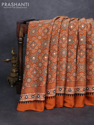 Modal silk saree dark mustard with allover ajrakh prints and mirror & sequin embroidery pallu