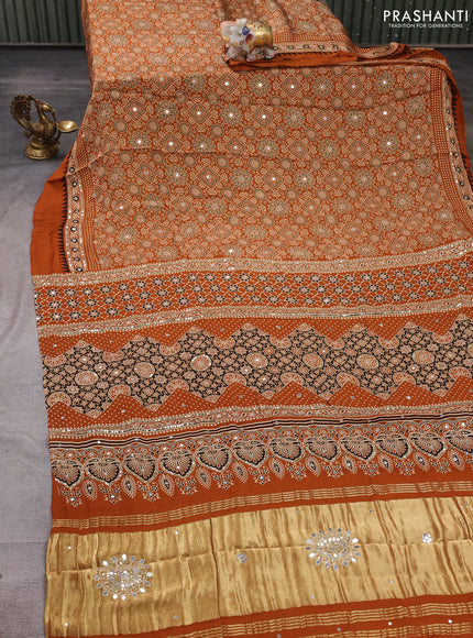 Modal silk saree dark mustard with allover ajrakh prints and mirror & sequin embroidery pallu