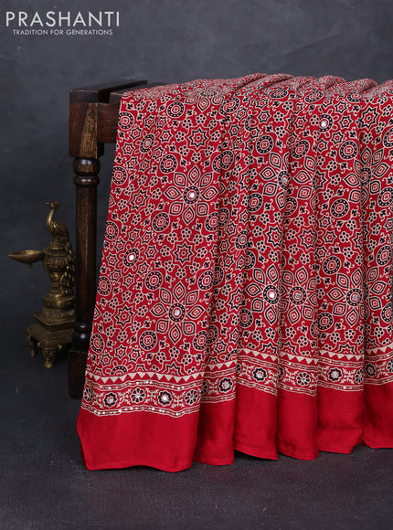 Modal silk saree tomato red with allover ajrakh prints and mirror & sequin embroidery pallu