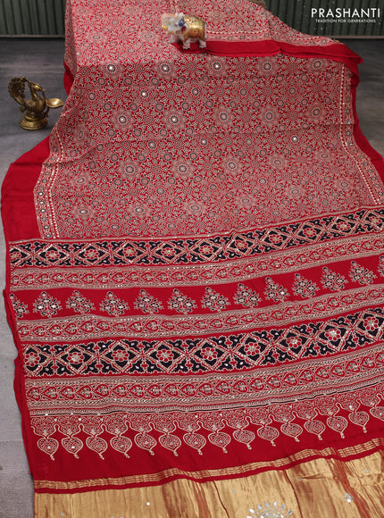 Modal silk saree tomato red with allover ajrakh prints and mirror & sequin embroidery pallu