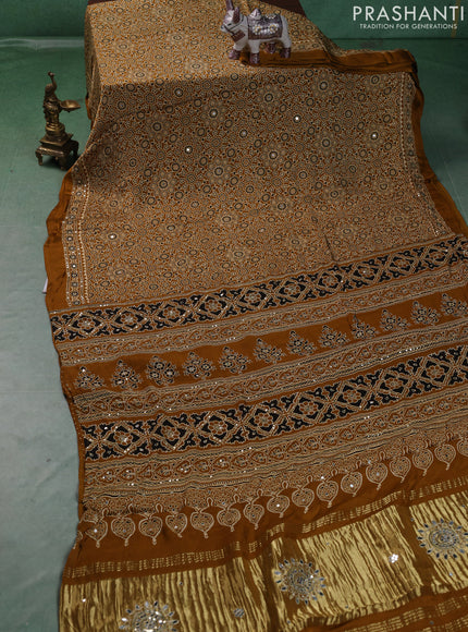 Modal silk saree dark mustard with allover ajrakh prints and mirror & sequin embroidery pallu
