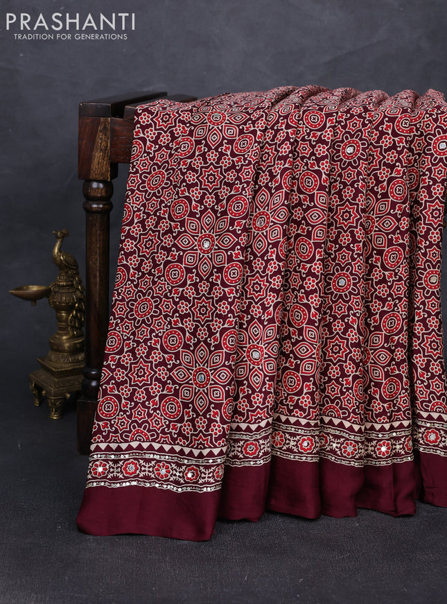 Modal silk saree deep maroon with allover ajrakh prints and mirror & sequin embroidery pallu