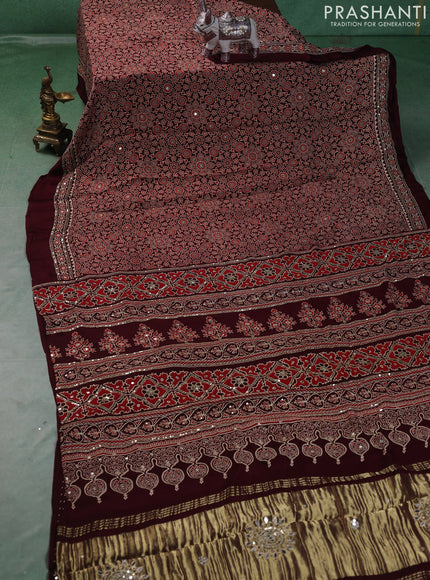 Modal silk saree deep maroon with allover ajrakh prints and mirror & sequin embroidery pallu