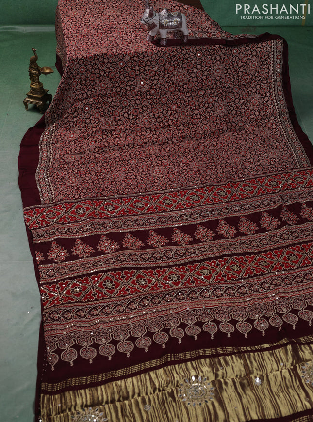 Modal silk saree deep maroon with allover ajrakh prints and mirror & sequin embroidery pallu