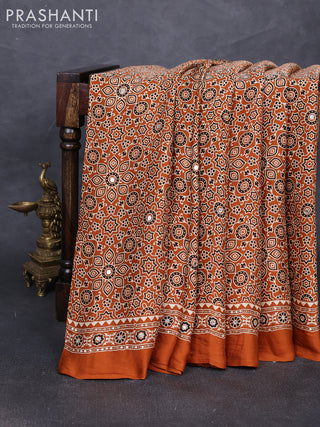 Modal silk saree dark mustard with allover ajrakh prints and mirror & sequin embroidery pallu