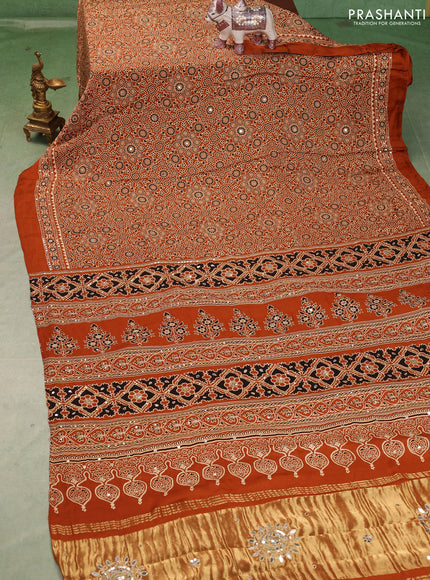 Modal silk saree dark mustard with allover ajrakh prints and mirror & sequin embroidery pallu