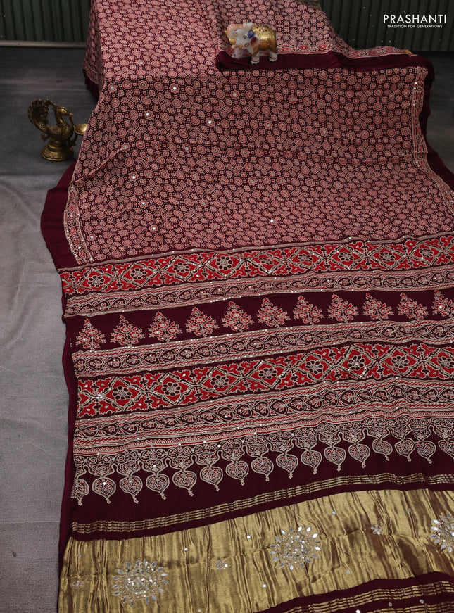 Modal silk saree wine with allover ajrakh prints and mirror & sequin embroidery pallu