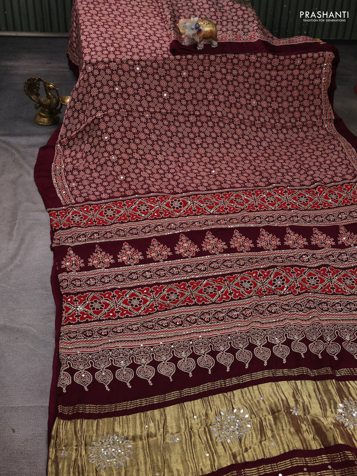 Modal silk saree wine with allover ajrakh prints and mirror & sequin embroidery pallu