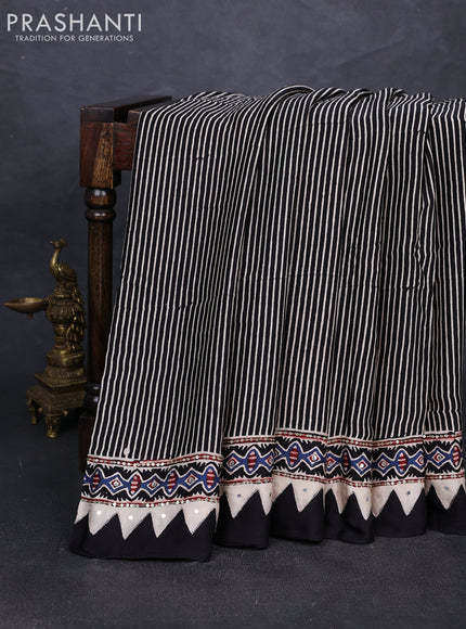 Modal silk saree black with allover stripe prints and ajrakh prints mirror & sequin embroidery pallu