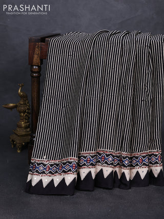 Modal silk saree black with allover stripe prints and ajrakh prints mirror & sequin embroidery pallu