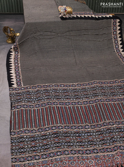 Modal silk saree black with allover stripe prints and ajrakh prints mirror & sequin embroidery pallu