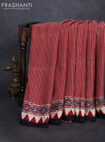 Modal silk saree maroon with allover stripe prints and ajrakh prints mirror & sequin embroidery pallu