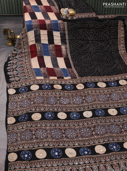 Modal silk saree black with allover geometric prints and ajrakh prints mirror & sequin embroidery pallu