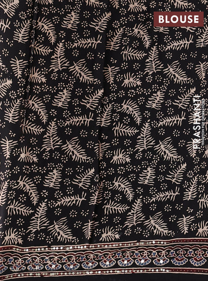 Modal silk saree black with allover geometric prints and ajrakh prints mirror & sequin embroidery pallu