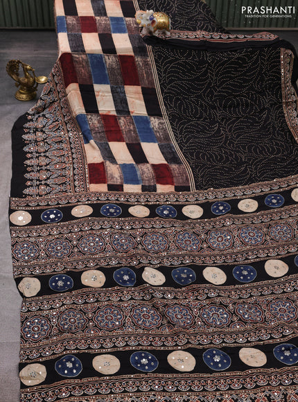 Modal silk saree black with allover geometric prints and ajrakh prints mirror & sequin embroidery pallu