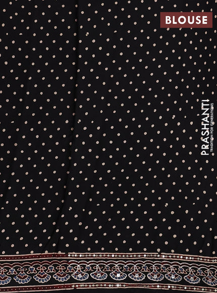 Modal silk saree black with allover geometric prints and ajrakh prints mirror & sequin embroidery pallu