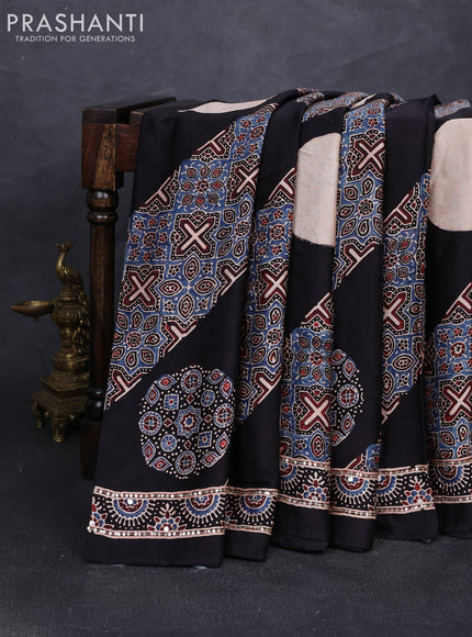 Modal silk saree black with ajrakh prints and mirror & sequin embroidery pallu