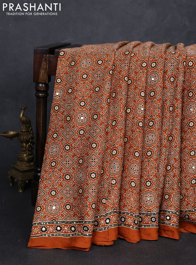Modal silk saree dark mustard with allover ajrakh prints and mirror & sequin embroidery pallu