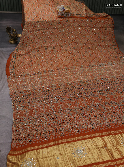 Modal silk saree dark mustard with allover ajrakh prints and mirror & sequin embroidery pallu