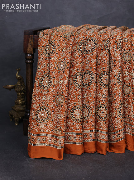 Modal silk saree dark mustard with allover ajrakh prints and mirror & sequin embroidery pallu