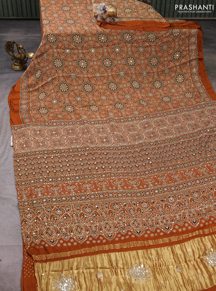 Modal silk saree dark mustard with allover ajrakh prints and mirror & sequin embroidery pallu
