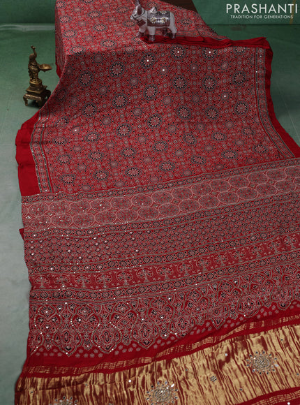 Modal silk saree red with allover ajrakh prints and mirror & sequin embroidery pallu