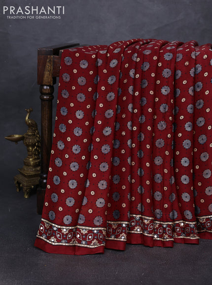 Modal silk saree maroon with allover ajrakh prints and mirror & sequin embroidery pallu