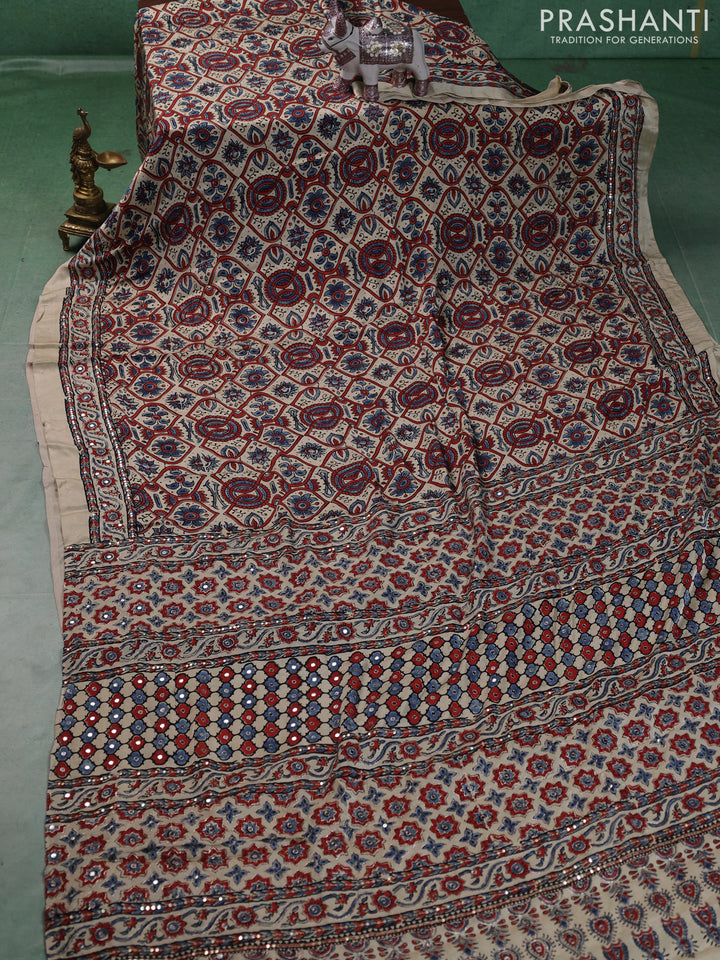 Modal silk saree cream with allover ajrakh prints and mirror & sequin embroidery pallu