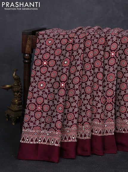 Modal silk saree wine shade with allover ajrakh prints and mirror & sequin embroidery pallu