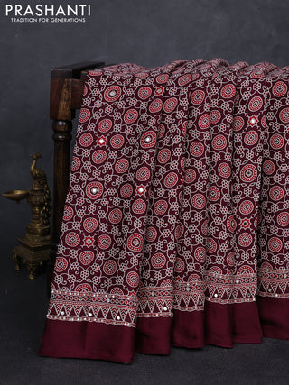 Modal silk saree wine shade with allover ajrakh prints and mirror & sequin embroidery pallu