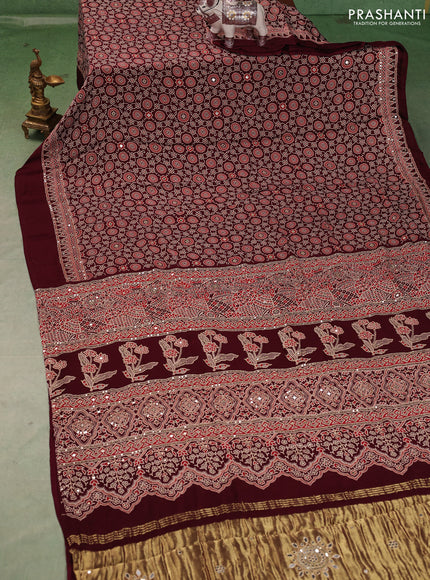 Modal silk saree wine shade with allover ajrakh prints and mirror & sequin embroidery pallu