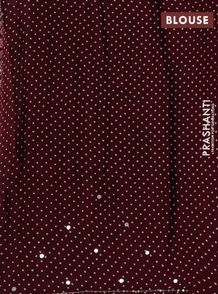 Modal silk saree wine shade with allover ajrakh prints and mirror & sequin embroidery pallu