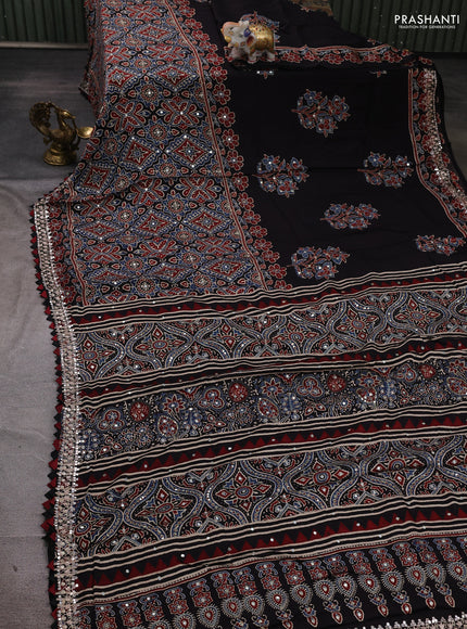 Modal silk saree black with allover ajrakh prints and mirror & sequin embroidery pallu