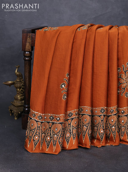 Modal silk saree dark mustard with ajrakh butta prints and mirror & sequin embroidery pallu