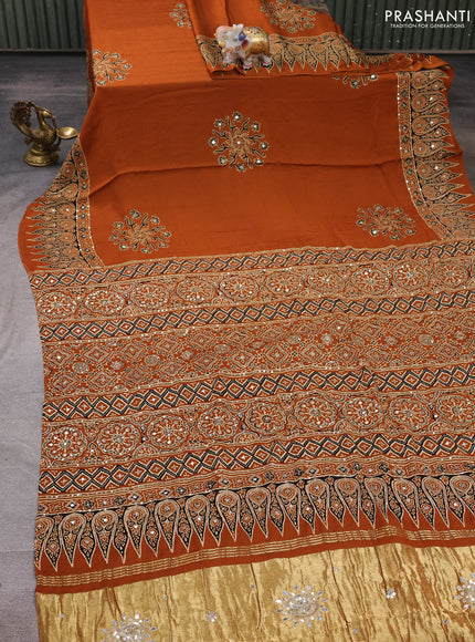 Modal silk saree dark mustard with ajrakh butta prints and mirror & sequin embroidery pallu